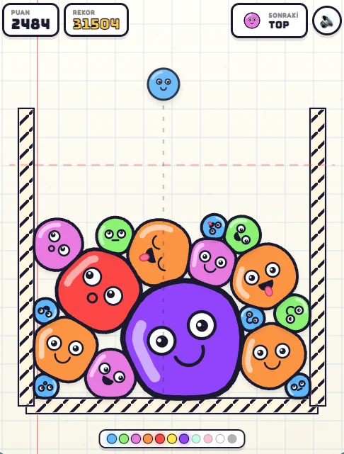 Ball Merge oyununda bir kapta üst üste duran renkli, gülümseyen toplar